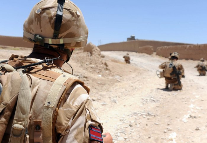 British soldiers on patrol in Sangin, Afghanistan come to a halt after a suspected IED is found up ahead.