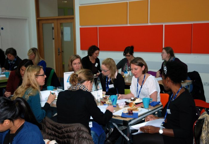 Female staff take part in a quiz at the forum