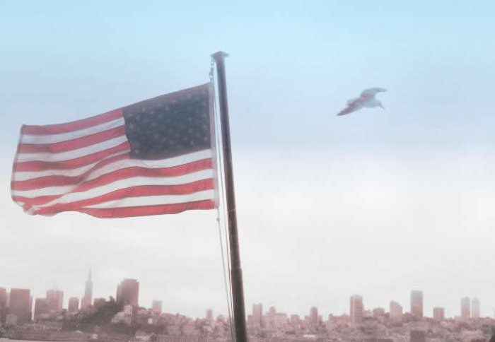 The USA flag in front of a view of San Francisco (Photo: B Mollett)