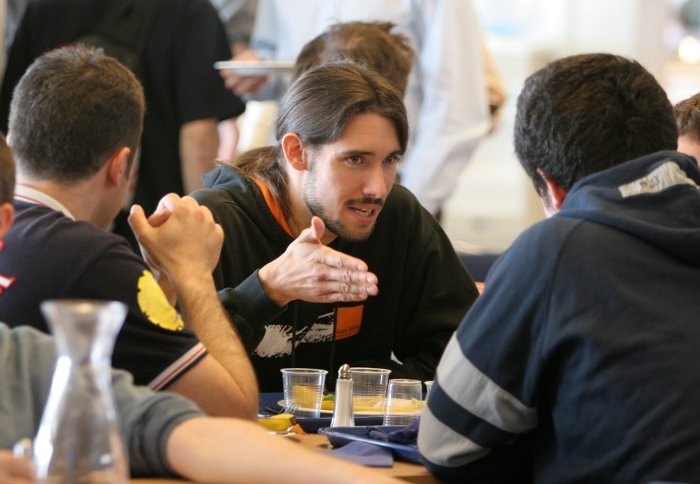 A student in debate with fellow students.