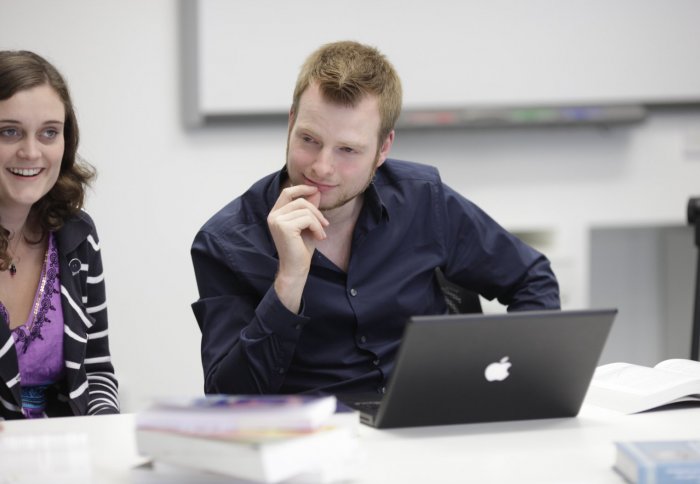 Two PhD students and a laptop.