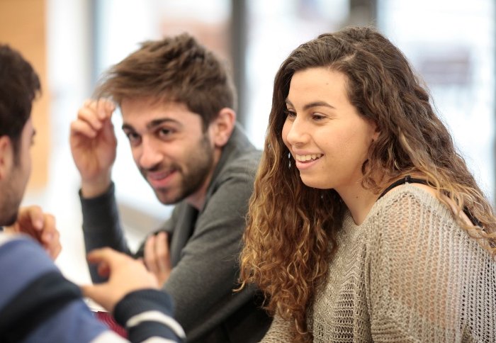 Two students deep in thought and/or conversation.