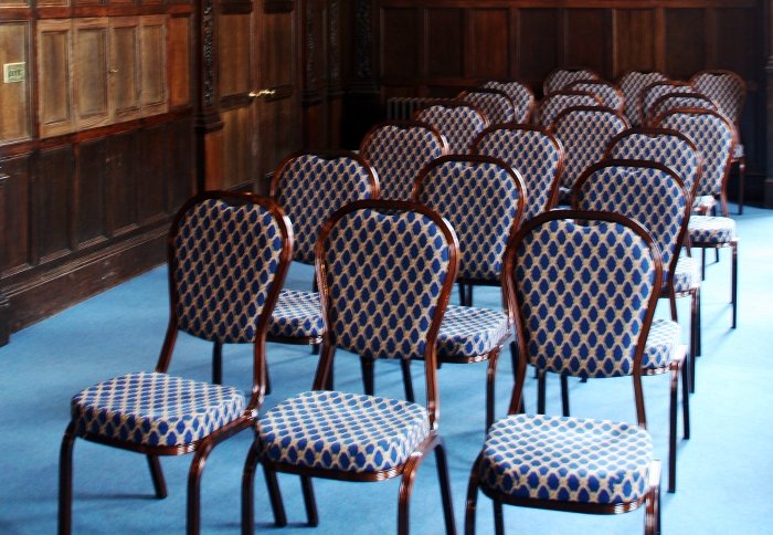 A set of chairs, in preparation for a conference