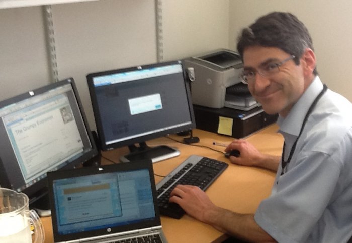 Professor Jonathan Haskel Tweeting from computers in his office