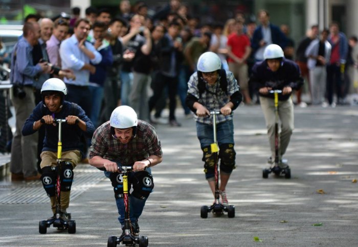 Second year students take part in the scooter race