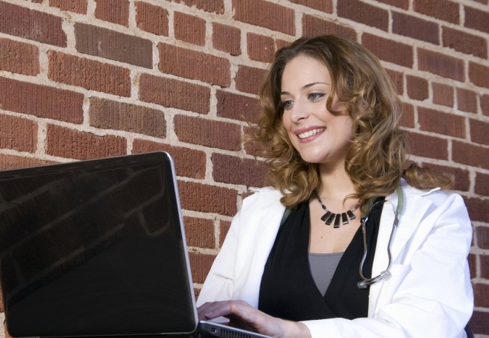 Female doctor using a laptop