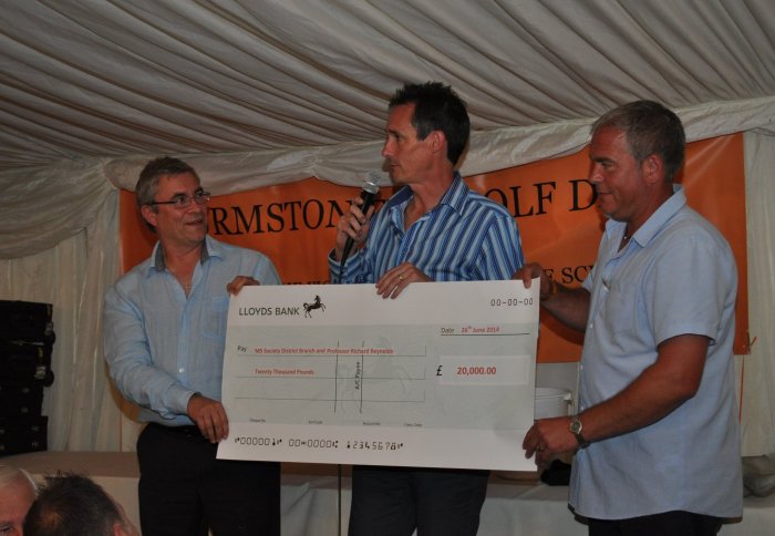 Nigel Furmston (centre) presents a cheque to Professor Richard Reynolds (left)  and Andy Holtom.