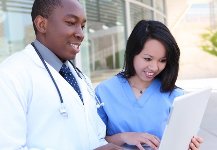 Doctors using a laptop