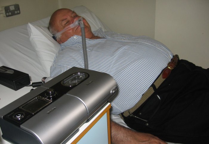 elderly patient using CPAP machine