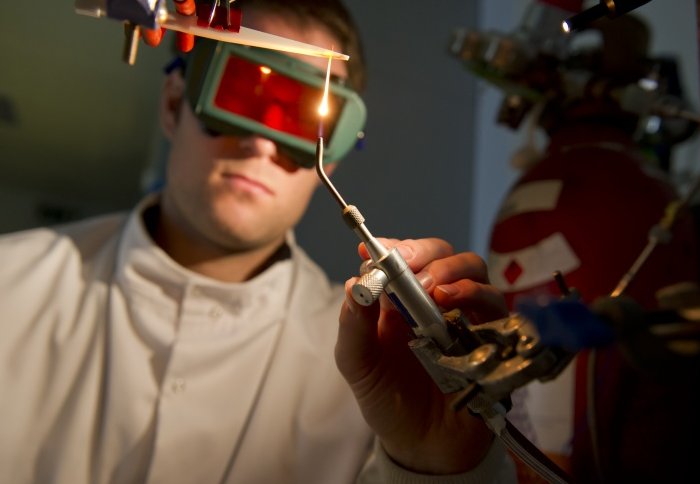 Electrochemical student doing an experiment.