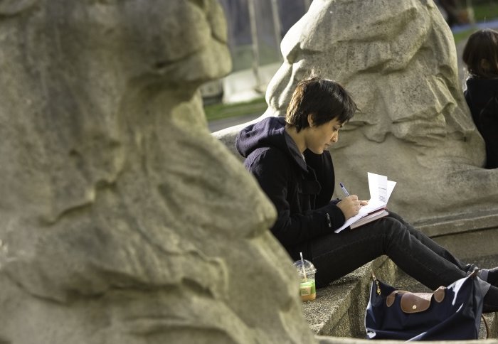 A student sitting on campus.