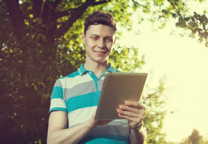 Young man with an iPad