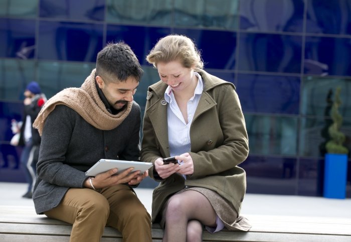 Two students using mobile devices.