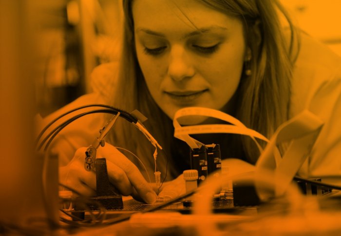 A female student with some electronics.