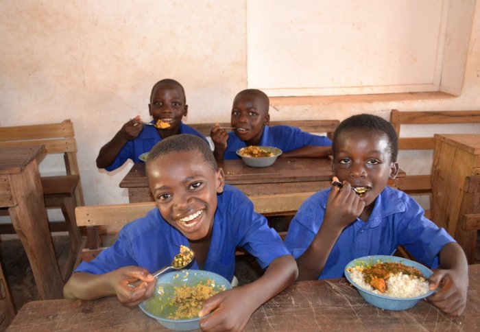 Children enjoying a healthy meal in Ghana