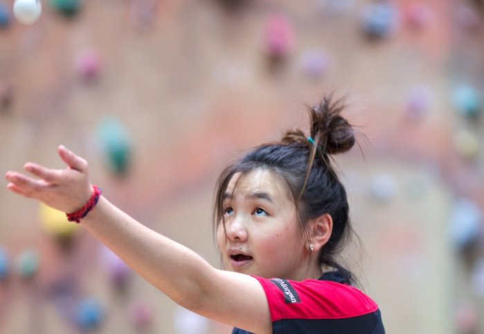 Female student playing table tennis