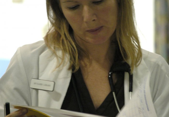 A doctor checking prescription notes