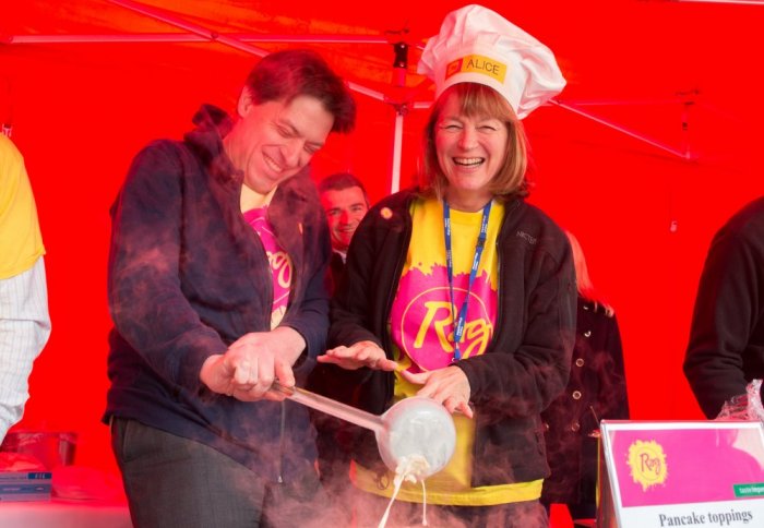 Imperial's Chief Financial Officer Muir Sanderson and President Alice Gast make pancakes at the RAG Week Launch event