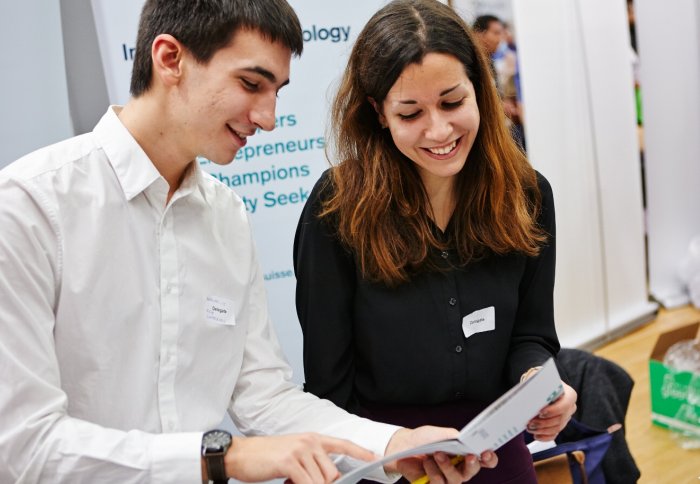 An employer talks with an Imperial student.