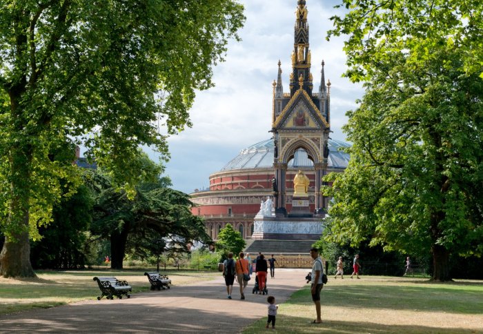 People in Hyde Park in the sunshine, Albert Memorial and Royal Albert Hall in the backgroun