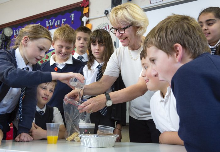Professor Maggie Dallman demonstrates the digestive system to students at Hayes Primary School in Bromley