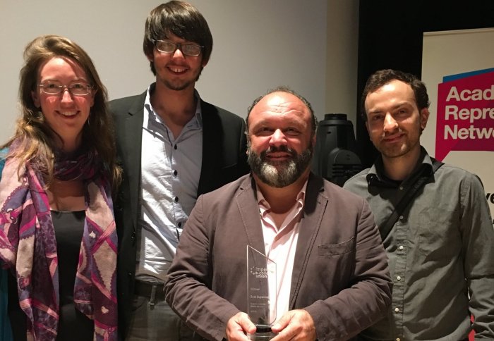 Prof Carillo (holding his award) with some of his post-doctoral research students