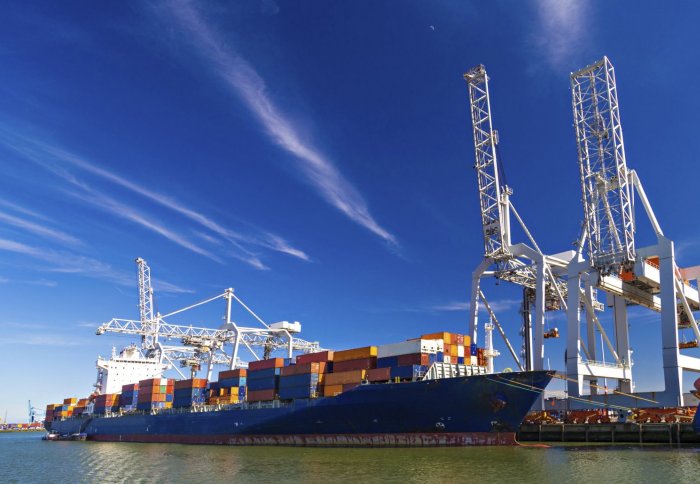 ship being filled with containers preparing for transport