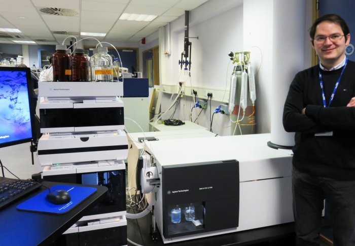 Dr. Gerald Larrouy-Maumus (Department of Life Sciences) in his lab with the machine