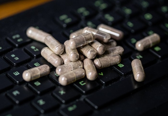 Pills piled up on a keyboard