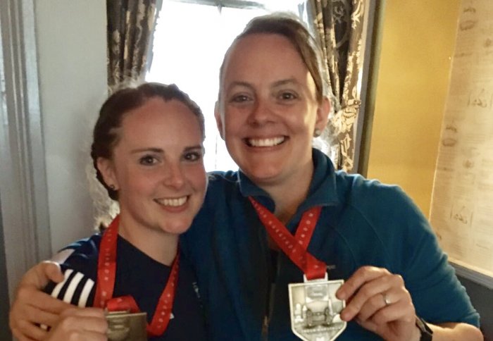 Jane and Liz holding medals