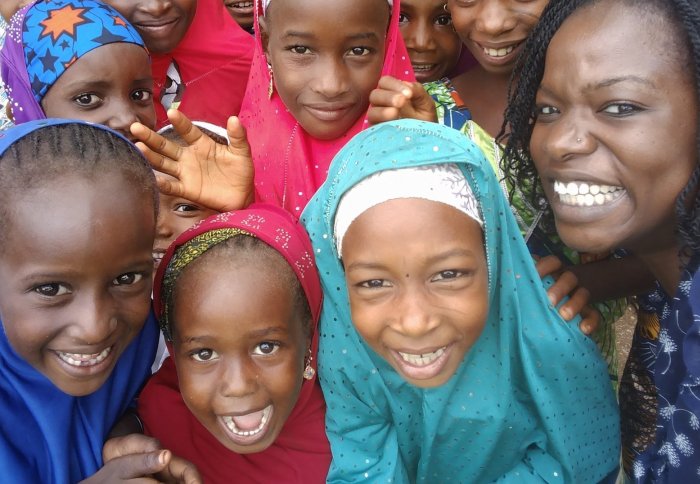 Yolisa Nalule with school-age children