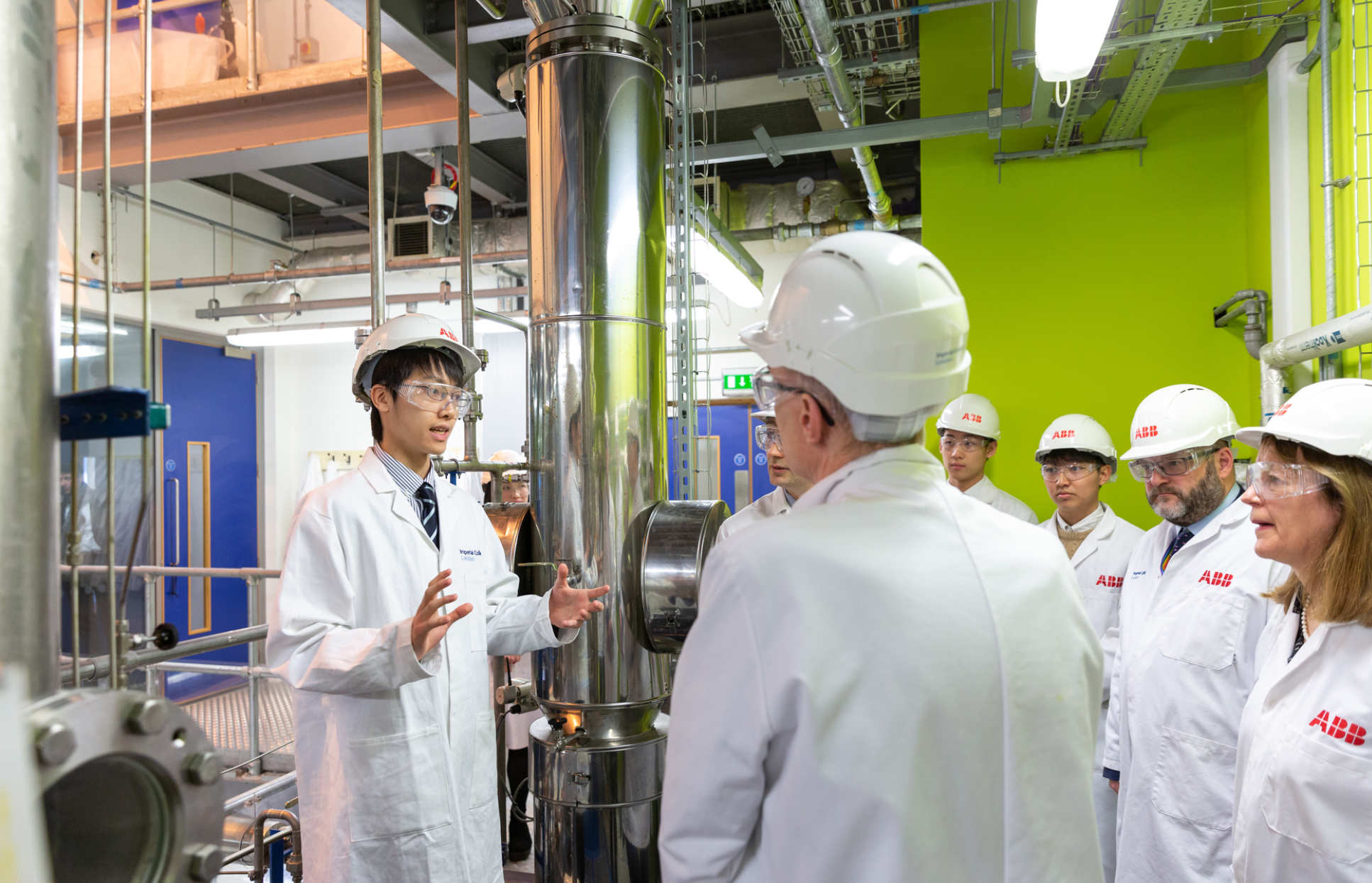 Students presenting to Sir Michael on carbon capture