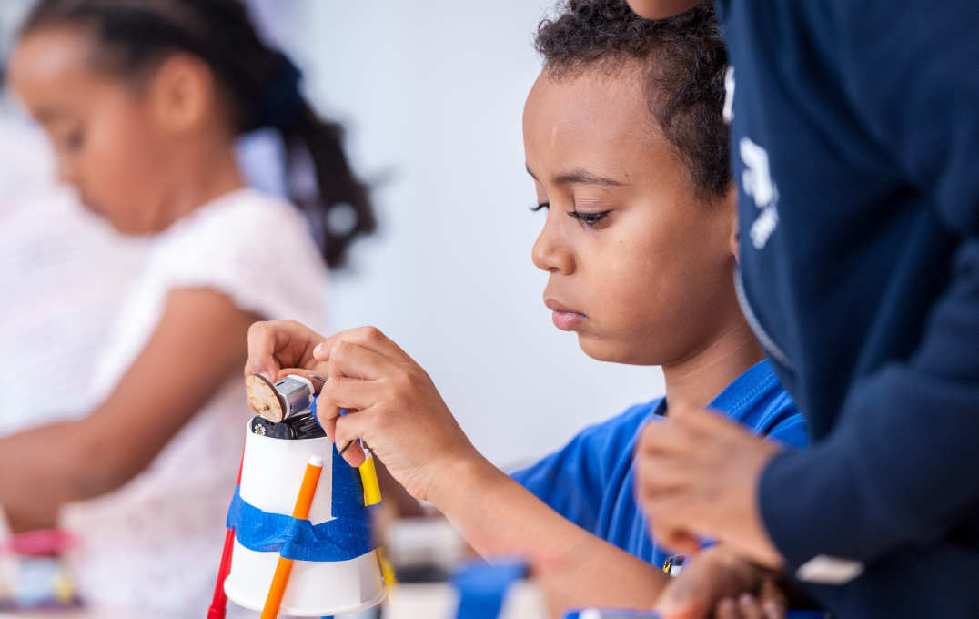 A child building a scribblebot