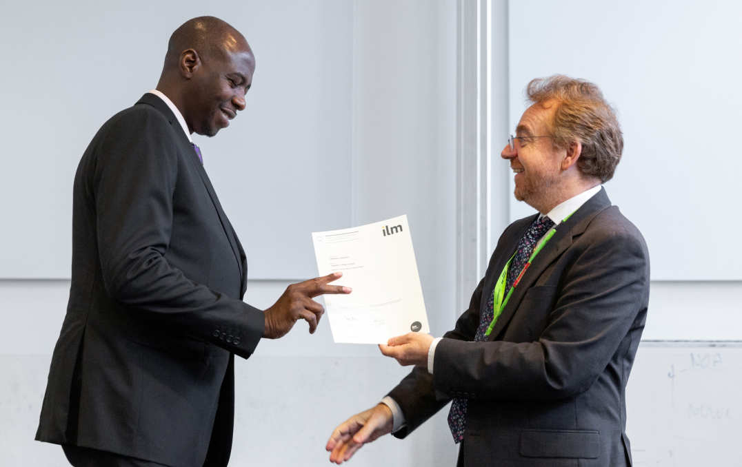 man collects certificate