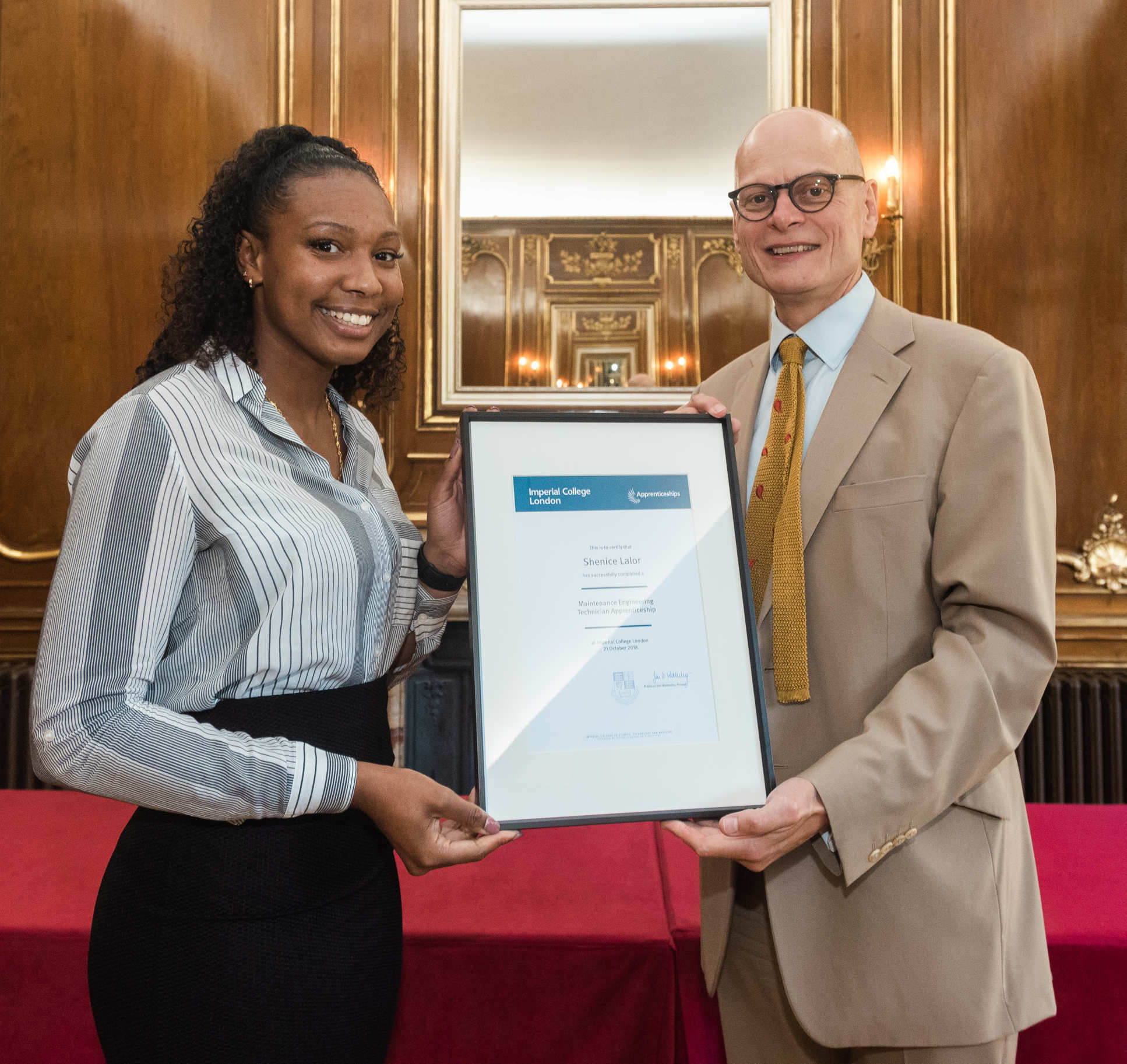 woman holds certificate