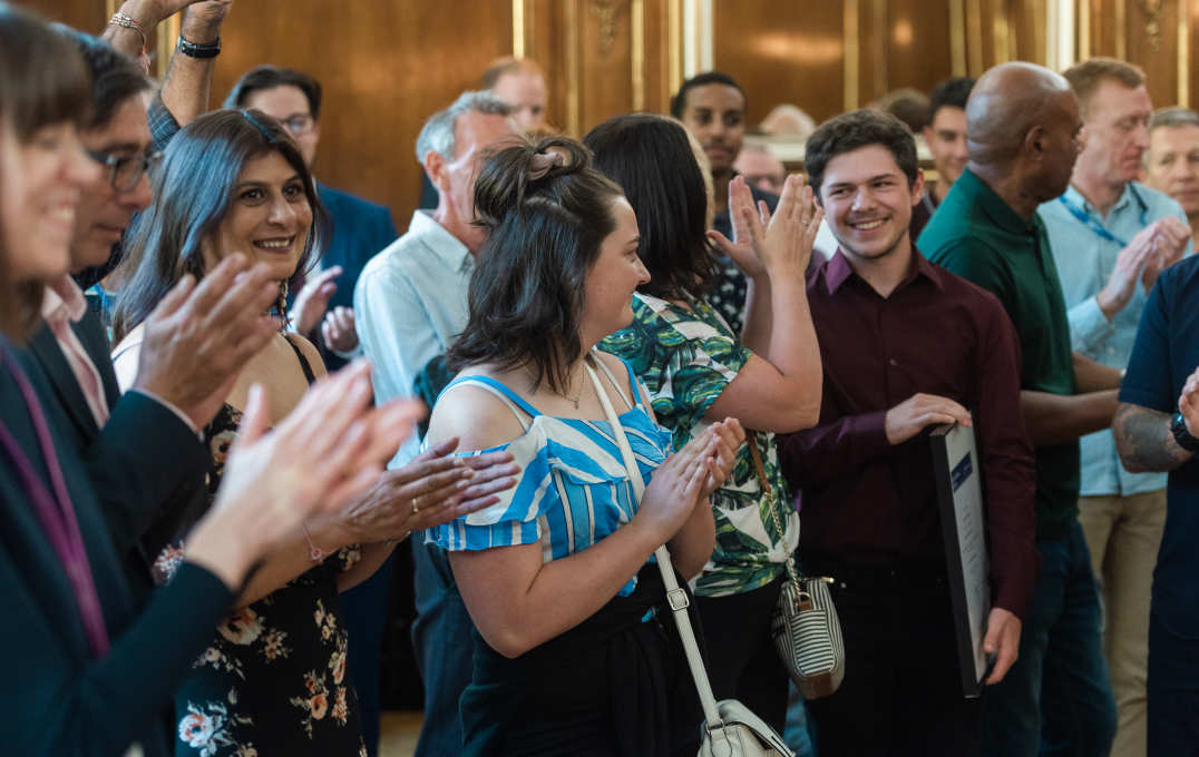 Crowd clapping hands