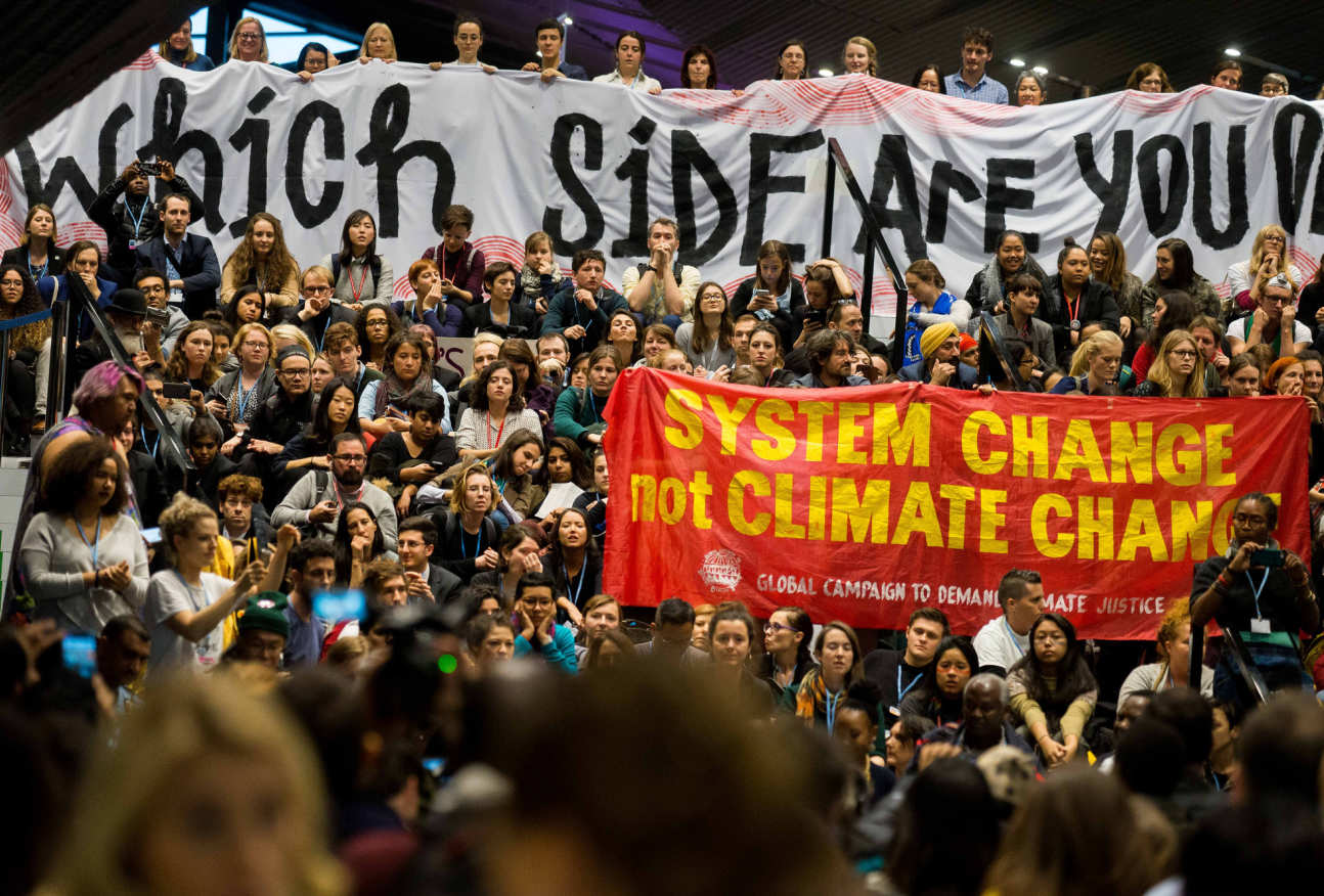 A crowd of climate change activists gathered with signs