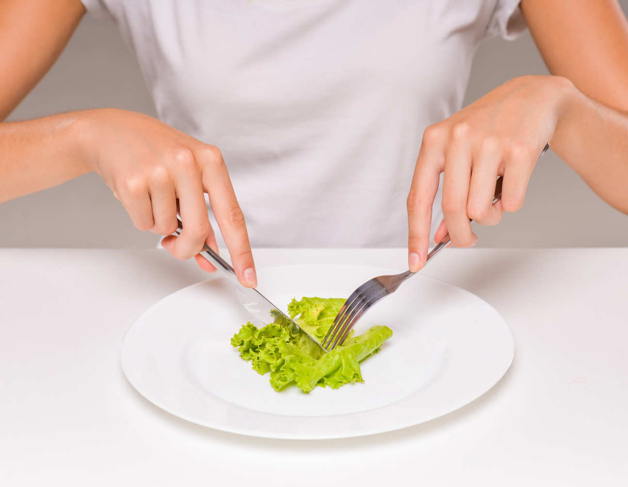 A woman eating lettuce