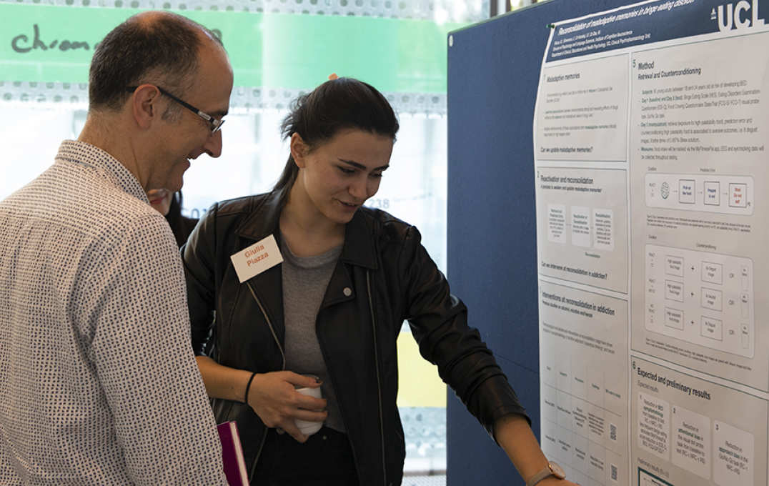 Student presenting a poster