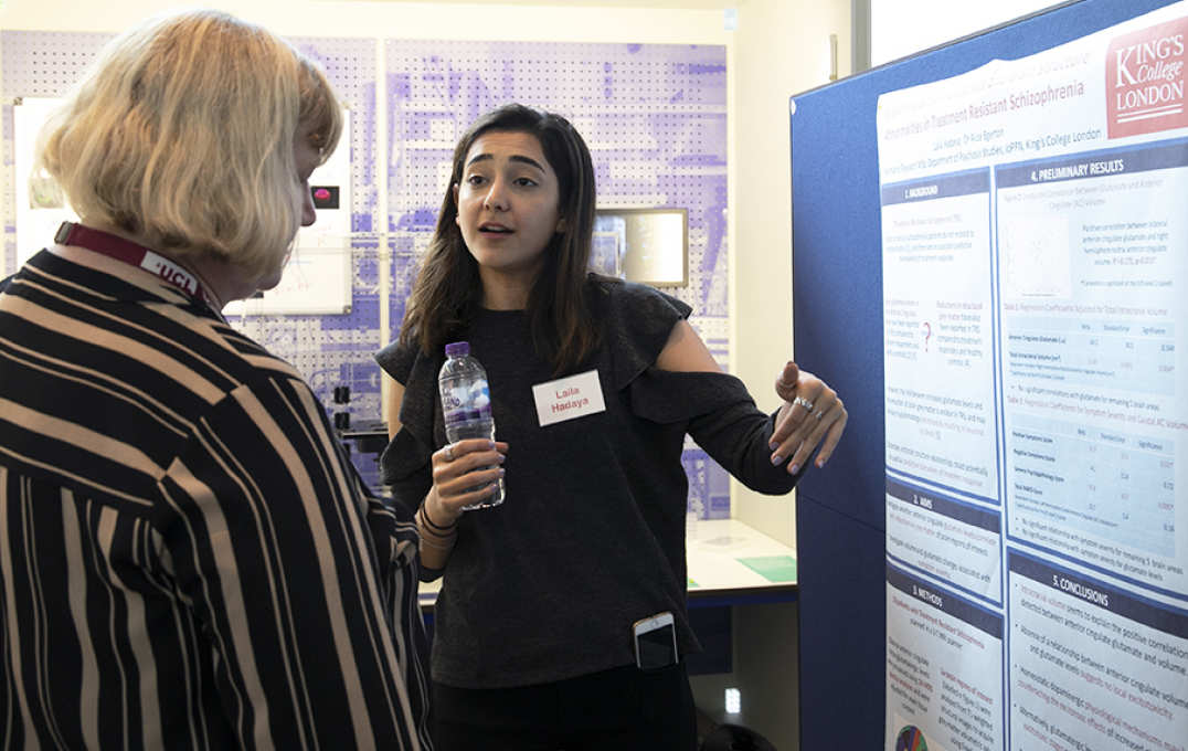 Student presenting a poster