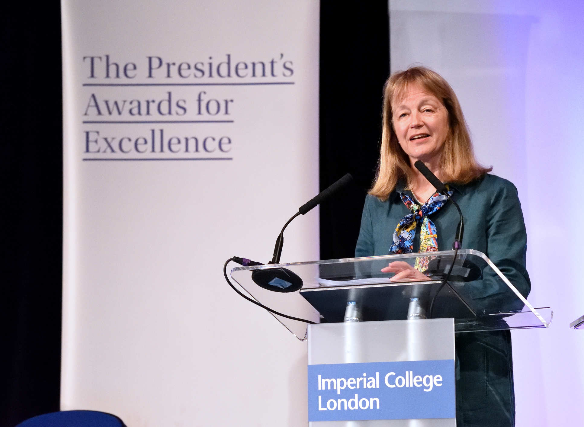 woman standing on stage