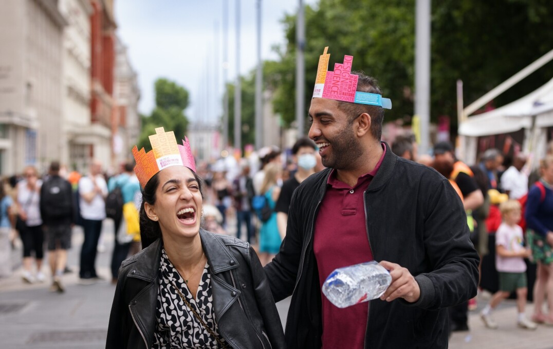 Two visitors to the Festival talking on Exhibition Road.