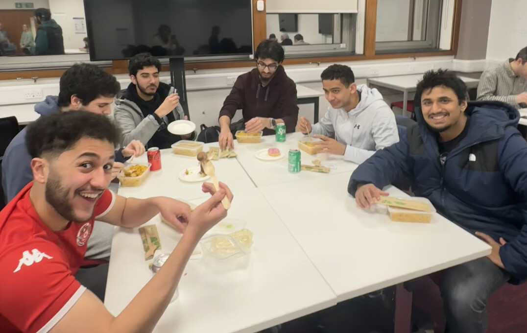 Happy diners - a table of students enjoying their meal