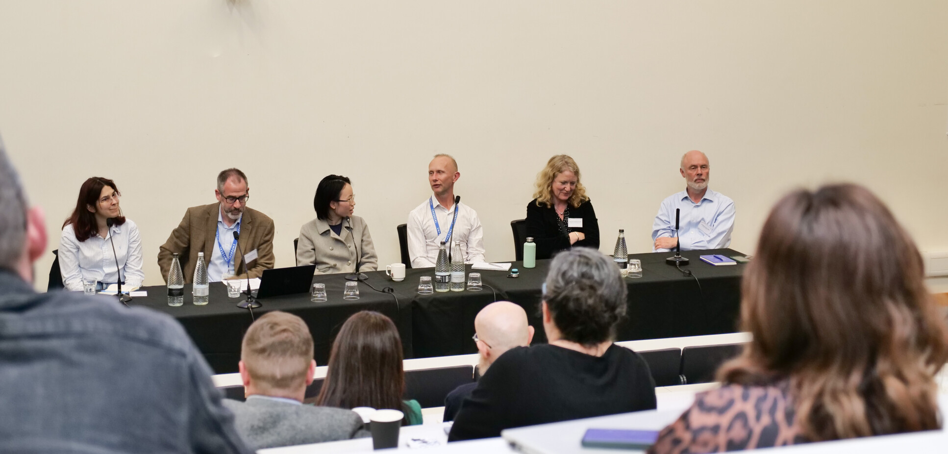 A panel discusses with an audience
