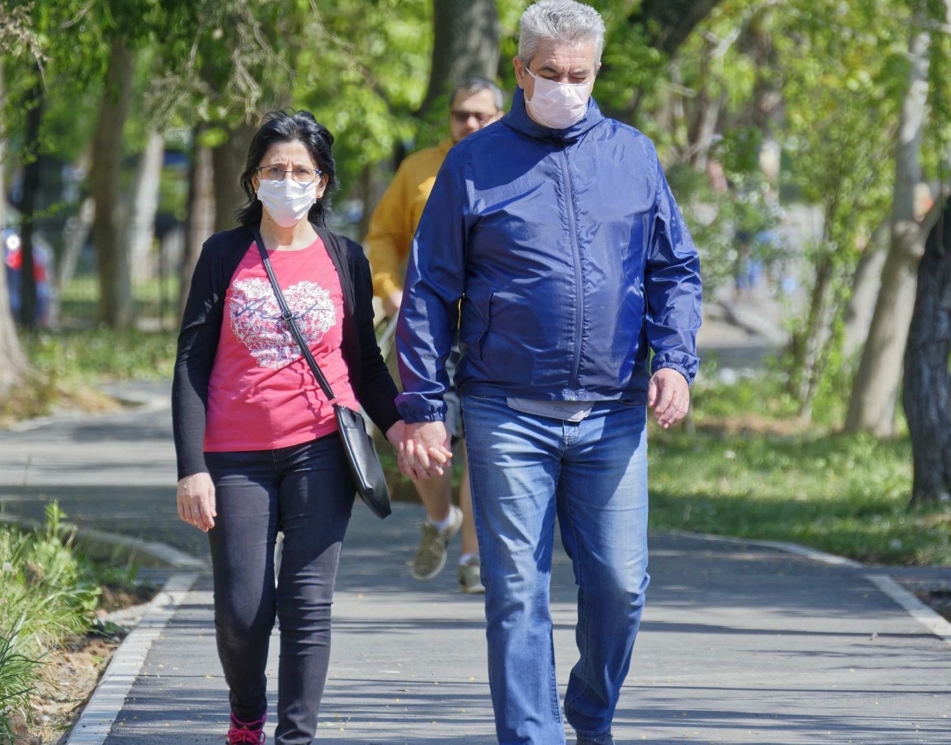 People walking outside with protective masks