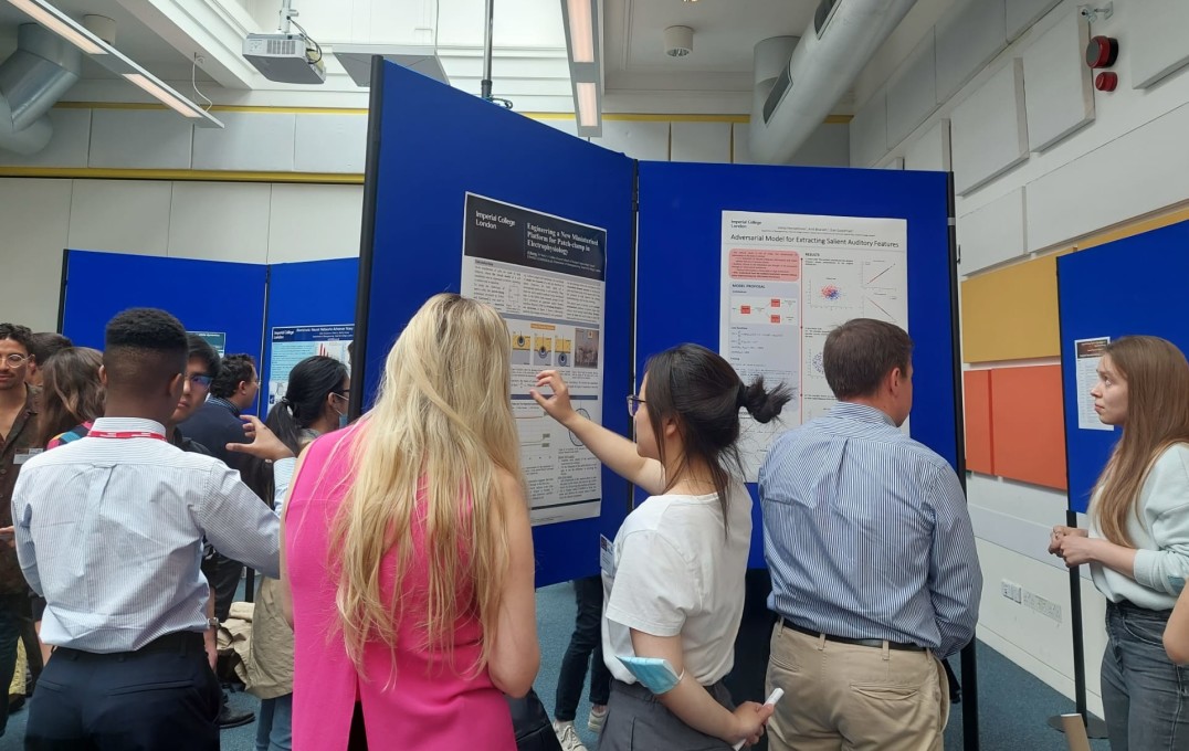 a student presenting her poster
