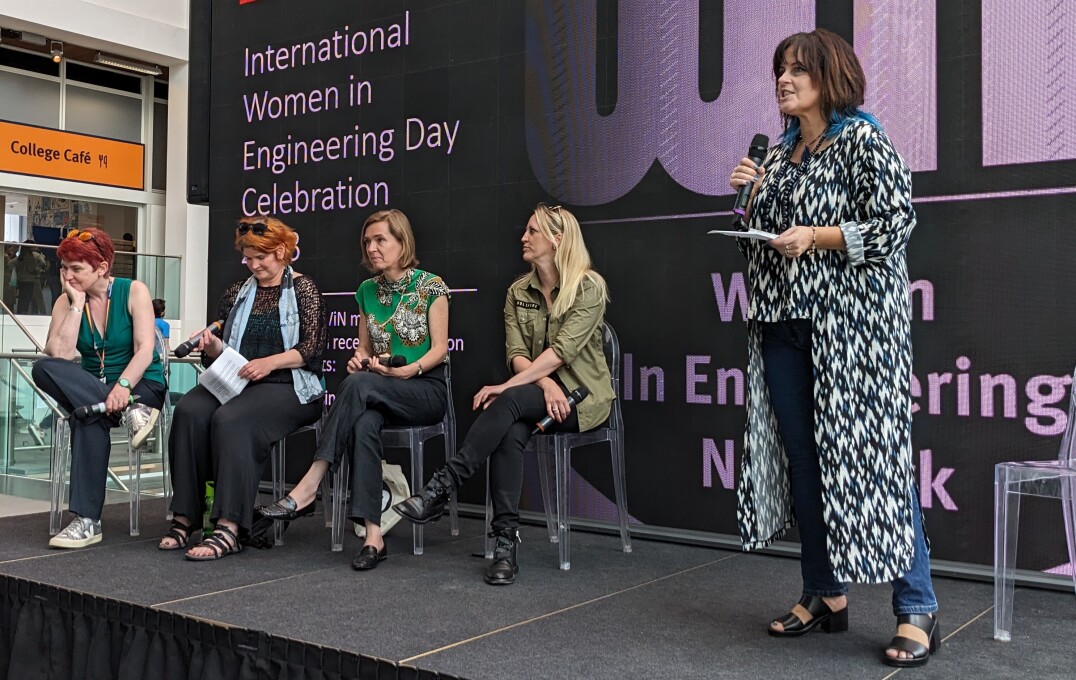 Julie McCann opening a panel session on a stage in Imperial's Main Entrance