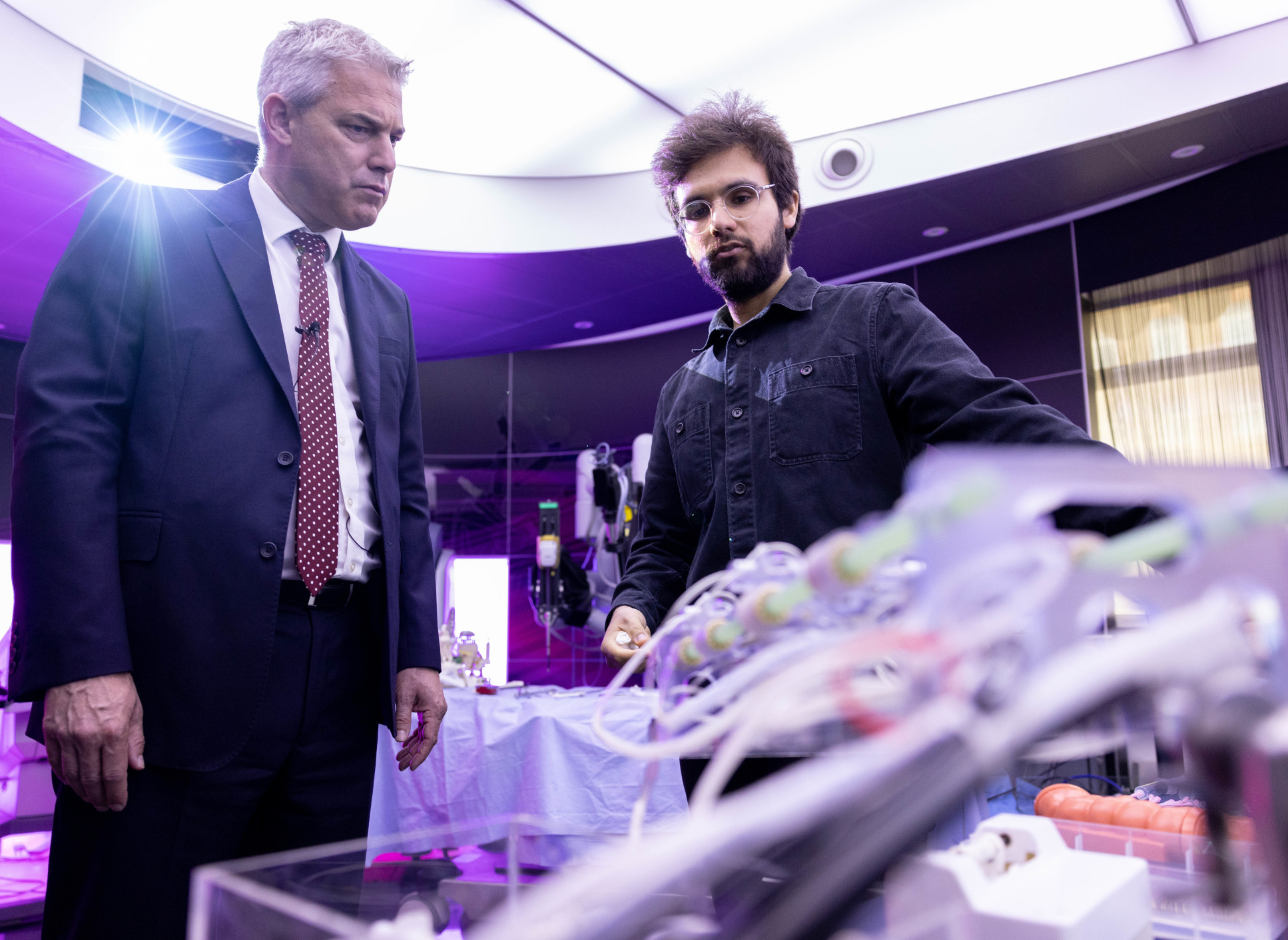 Two people looking at equipment in lab