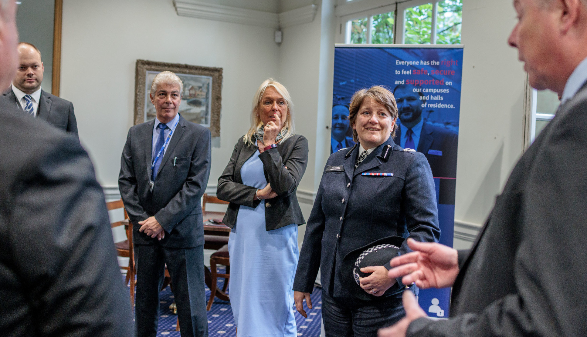 A group of attendees at the accreditation event talking