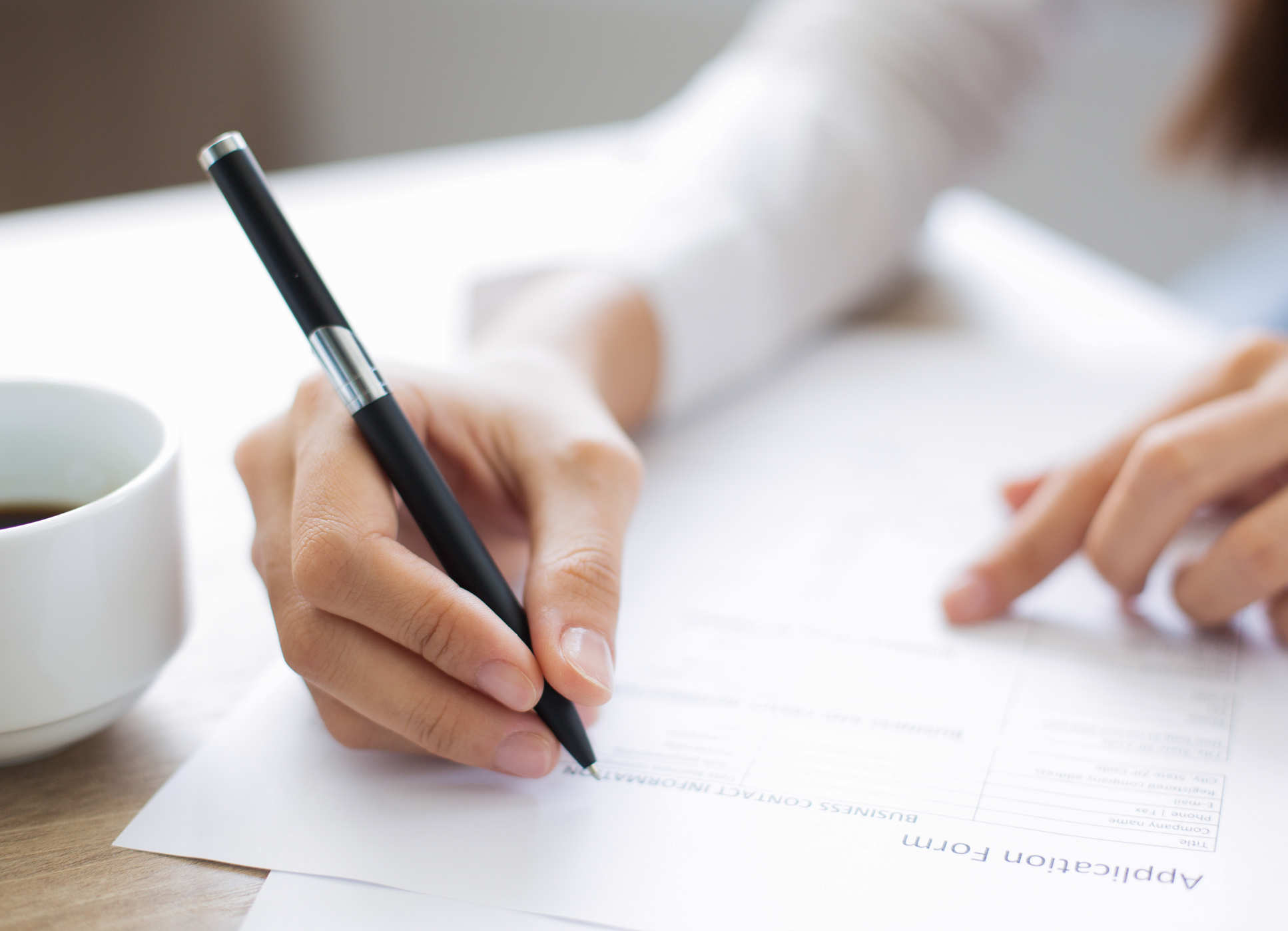 Hand filling in an application form